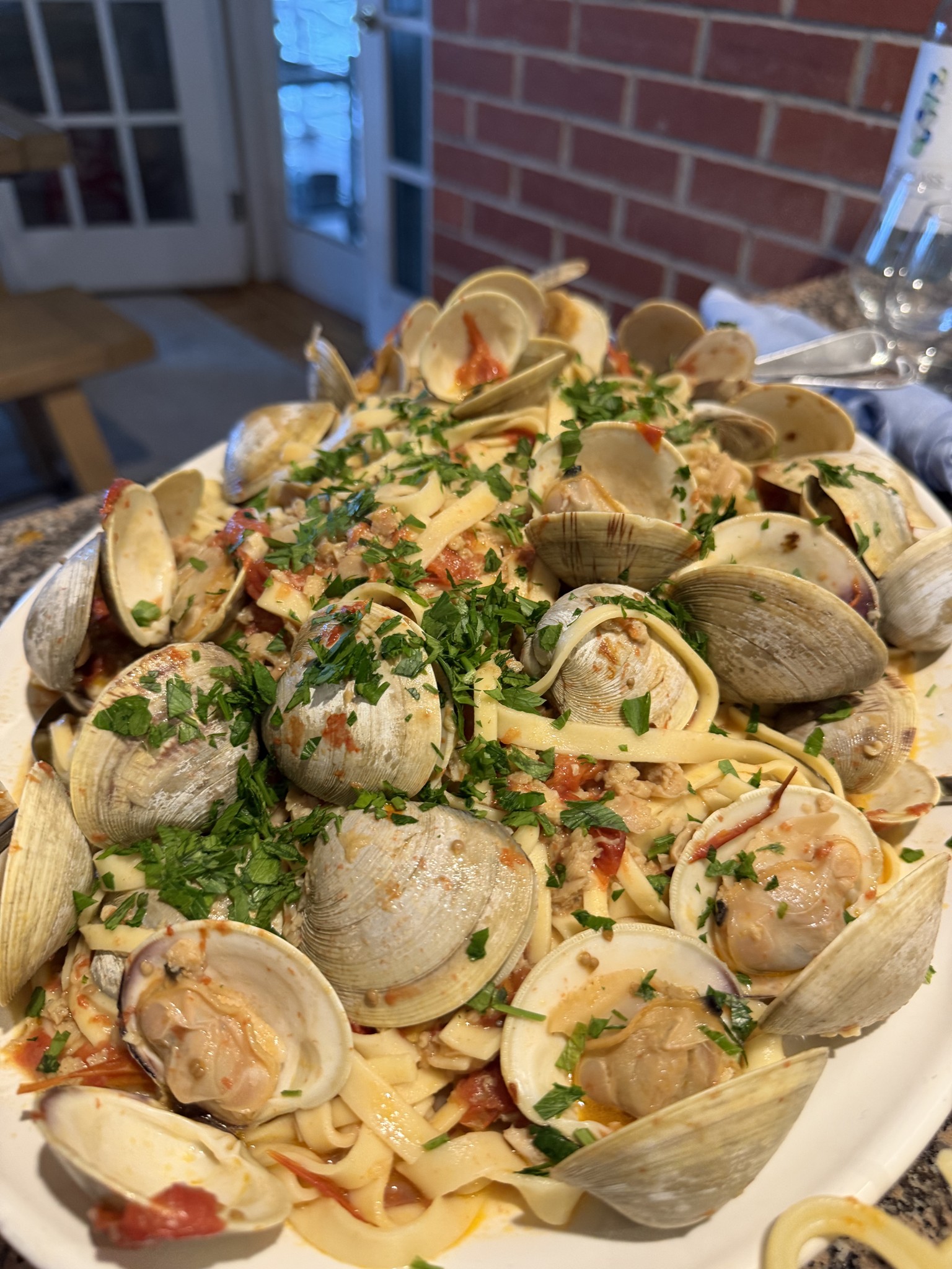 A platter of fresh linguine with littleneck clams, tomatoes and parsley