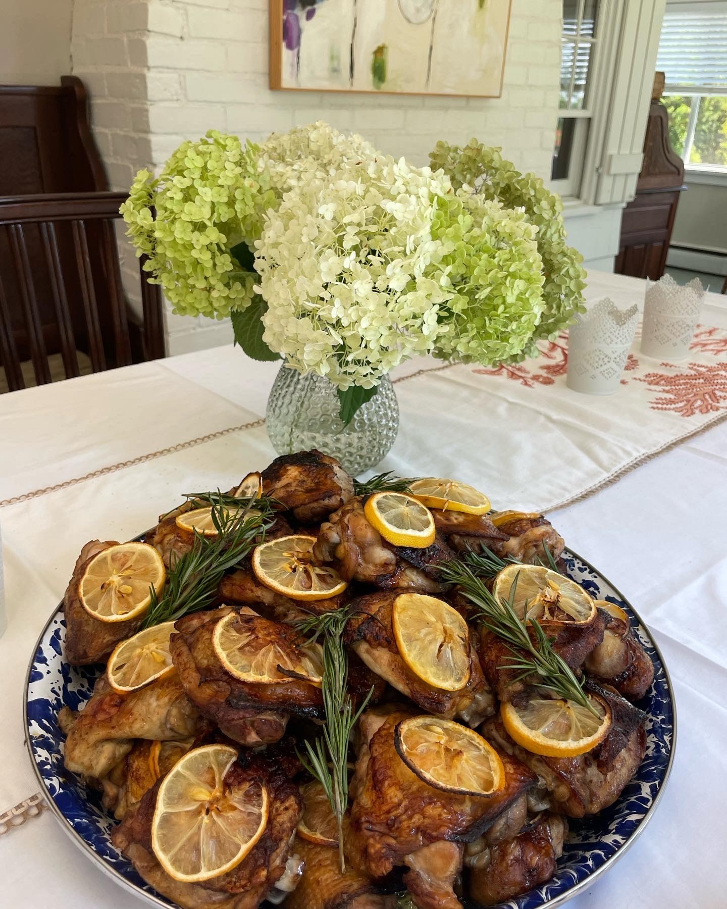 Lemon and rosemary chicken served with hydrangeas