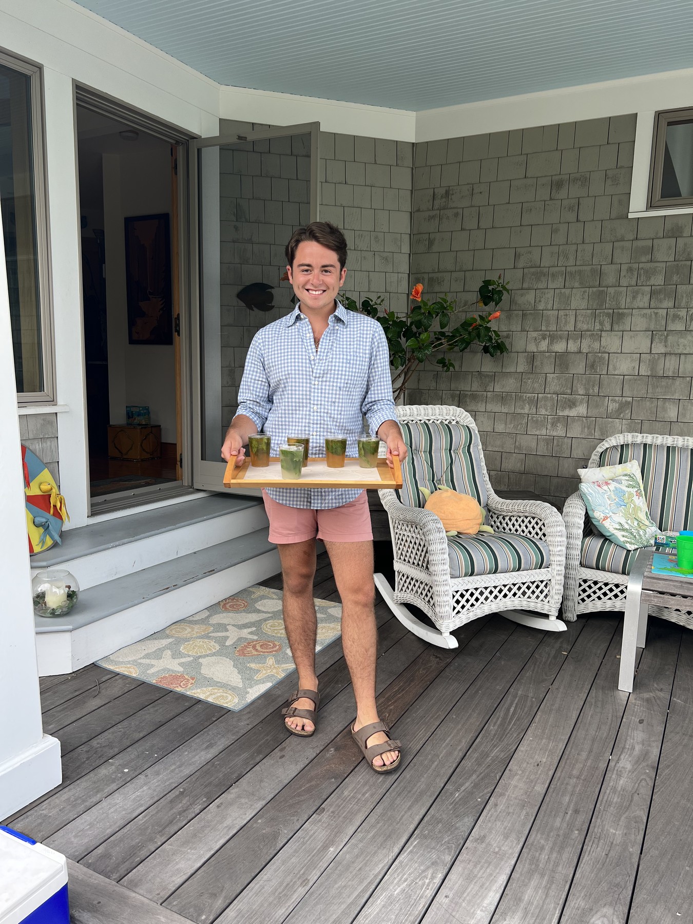 Sebastian carrying a prepared catering tray